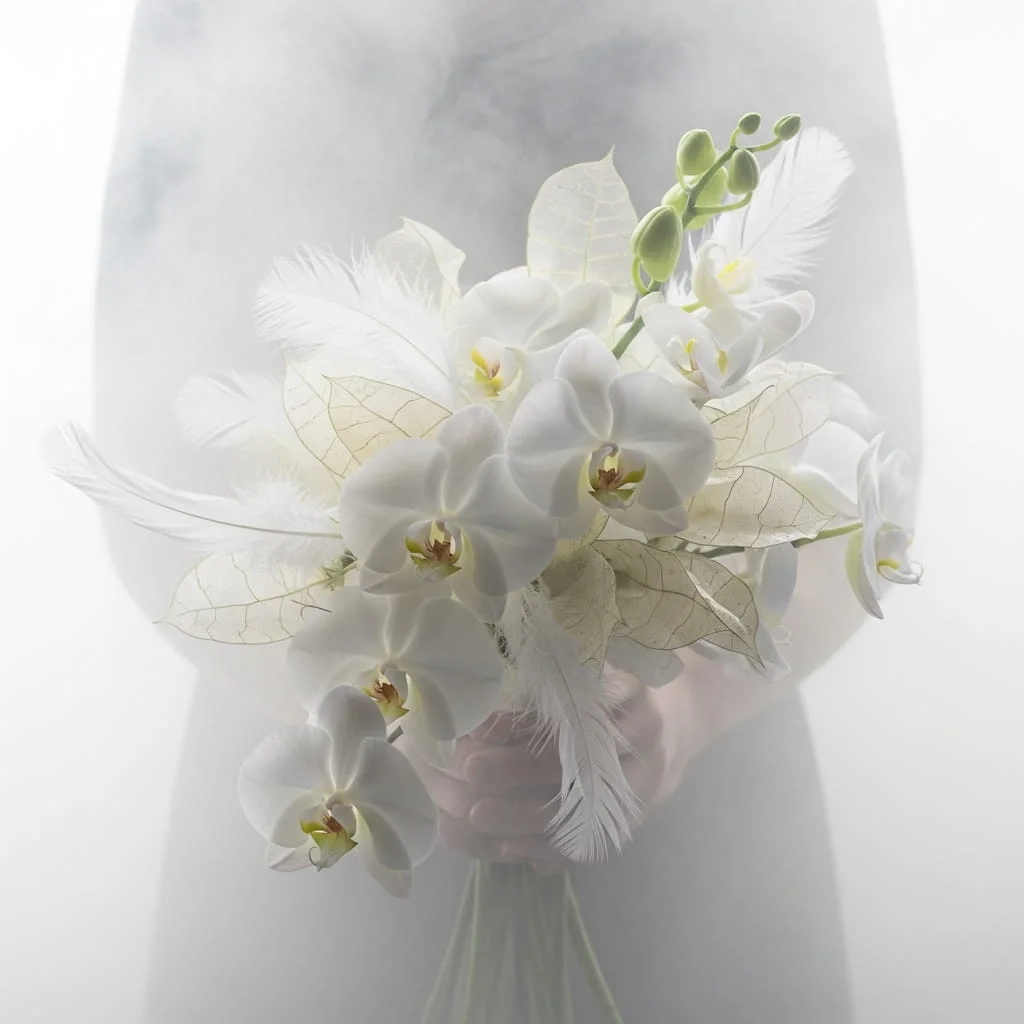 Ethereal zen wedding bouquet with white phalaenopsis orchids white feathers and translucent lunaria seed pods